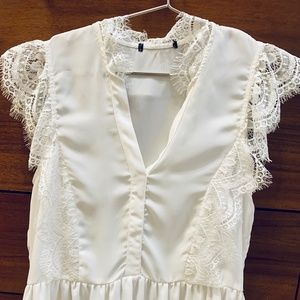 Lace trimmed sleeveless blouse